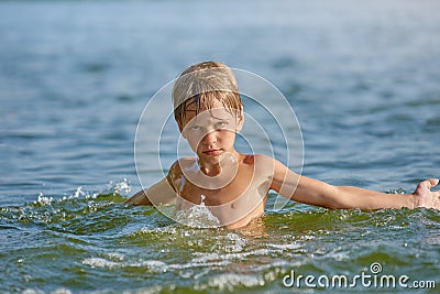 Young boy in the lake Stock Photo