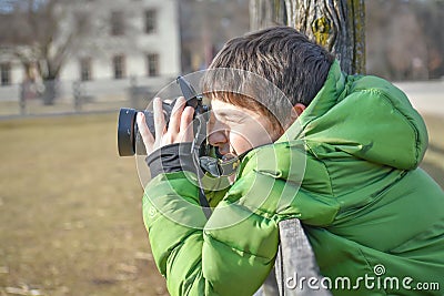 Young Boy Photographer Aiming Camera Stock Photo