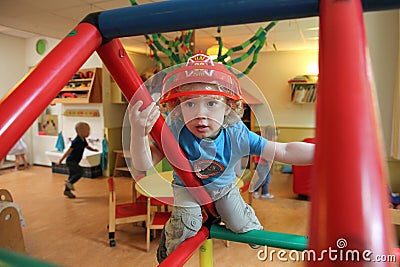 Young boy playing in a creche (nursery) Editorial Stock Photo