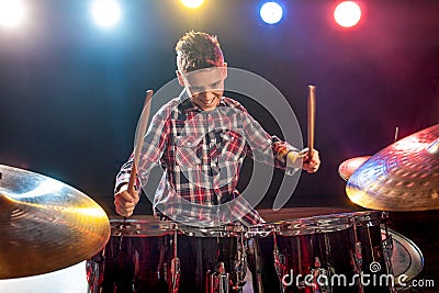 Young boy playing drums Stock Photo