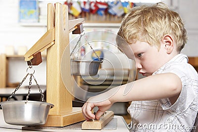 Young Boy Playing at Montessori/Pre-School Stock Photo