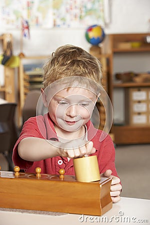 Young Boy Playing at Montessori/Pre-School Stock Photo