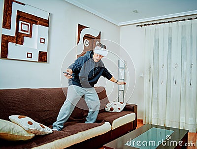 Young boy playing video games with 3d glasses Stock Photo