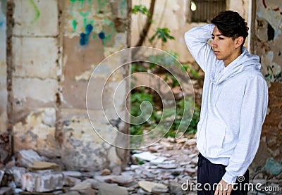 Young boy in an abandoned house Stock Photo