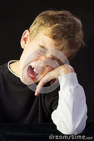 A Young Boy Protests Loudly Stock Photo