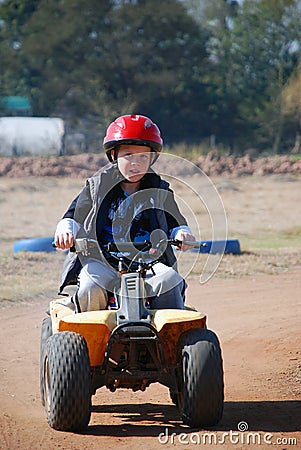 Young Boy on Quadbike Stock Photo