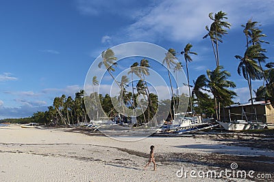 Young Boy Running on a White Sand Beach Panglao, Philippines Stock Photo