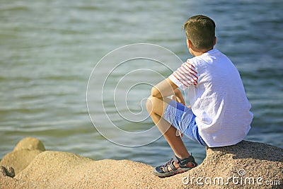 Young boy seeing the sea Stock Photo