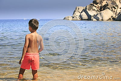 Young boy seeing the sea Stock Photo