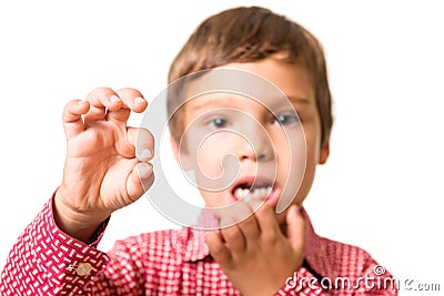 Young boy showing his first lost milk-tooth Stock Photo