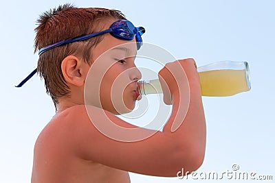 Young Boy Slaking his Thirst Stock Photo