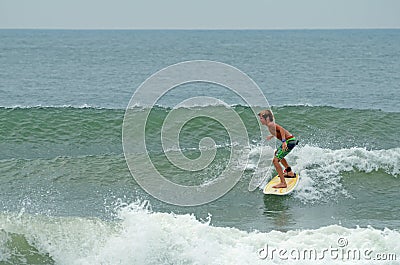 Young Boy Surfing Wrightsville Beach, NC Editorial Stock Photo