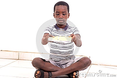 Portrait of a young boy giving a notebook Stock Photo