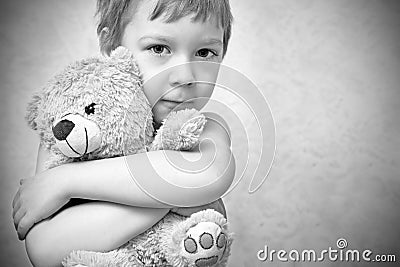 Young boy with teddy bear, portrait Stock Photo