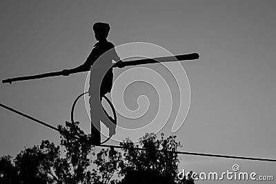 Young Boy Tightrope walking, Slacklining, Funambulism, Rope Balancing Stock Photo