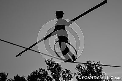 Young Boy Tightrope walking, Slacklining, Funambulism, Rope Balancing Stock Photo
