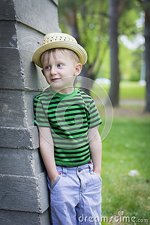 Young boy wearing a fedora at the park Stock Photo