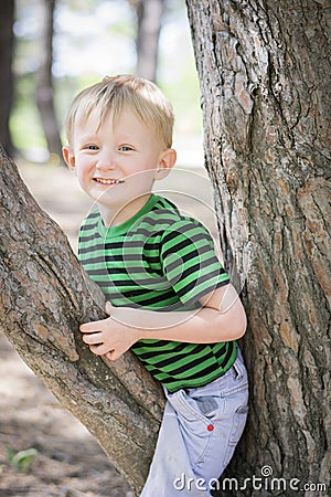 Young boy wearing a fedora at the park Stock Photo