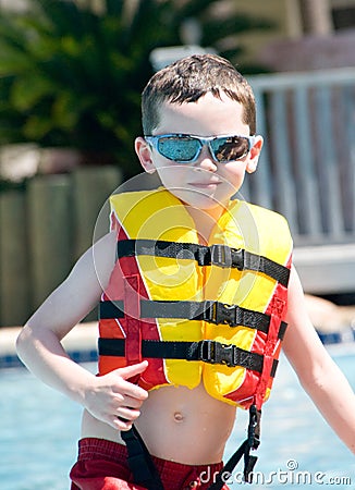 Young boy wearing flotation device Stock Photo