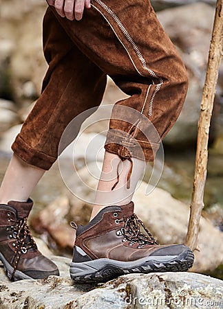 Young boy wearing lederhosen and hiking boots Stock Photo