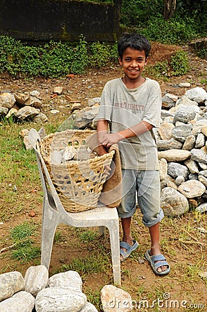 Young Boy works hard as porter, India Editorial Stock Photo