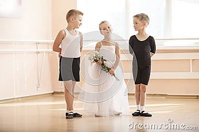 Young boys and a girl with flowers posing gracefully Stock Photo