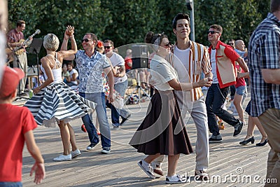 Moscow, Russia, September 08, 2018: boys and girls dancing on the dance floor in Gorky Park Editorial Stock Photo