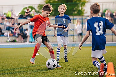 Young boys playing soccer game. Training and football match between youth soccer teams Stock Photo