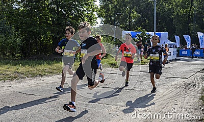 Young boys runners compete at the event of Kids Run Editorial Stock Photo