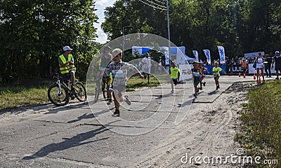 Young boys runners compete at the event of Kids Run Editorial Stock Photo