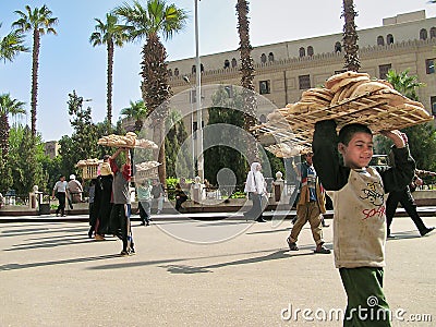 Young boys selling breads in Egyptian bazaar Khan el-Khalili, Editorial Stock Photo