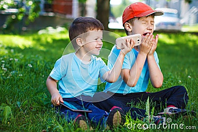 Young boys with wireless smartphone and tablet goodwill Stock Photo