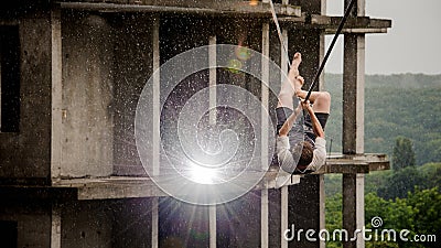 Young and brave man balancing on a slackline Stock Photo
