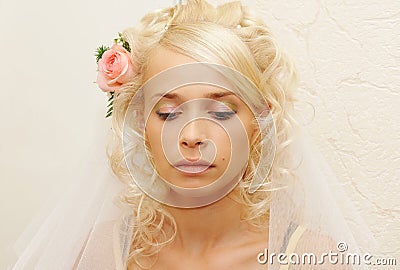Young bride doing make-up Stock Photo