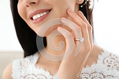 Young bride wearing beautiful engagement ring Stock Photo