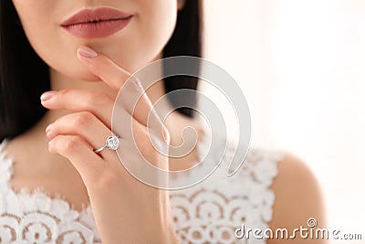 Young bride wearing beautiful engagement ring Stock Photo