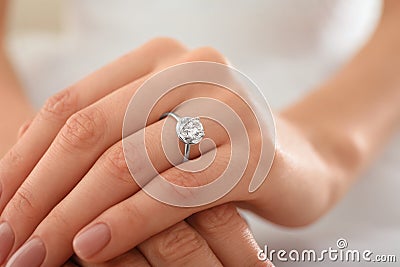 Young bride wearing beautiful engagement ring, closeup Stock Photo