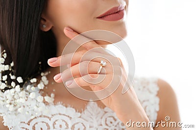 Young bride wearing beautiful engagement ring, closeup Stock Photo