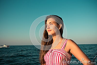 Young brunet woman in the red dress Stock Photo