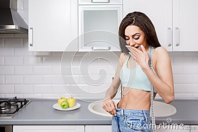 Young Brunette is Astonished by the Extent She Has Lost Weight Stock Photo