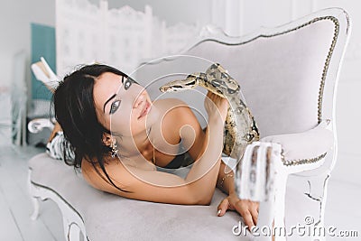 Young brunette posing with a snake python Stock Photo