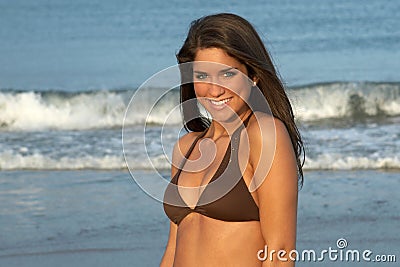 Young Brunette Woman in Brown Bikini Top Stock Photo