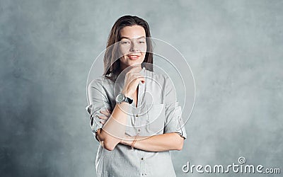 Young brunette woman in casual clothes, self-confidence. Smiling and calm girl Stock Photo