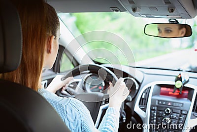 Young brunette woman driving a car Stock Photo