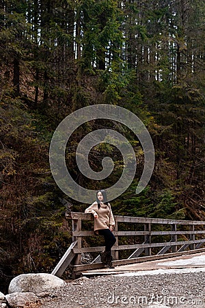 Young brunette woman explores new, magical, and fantastic places around the world. Portrait of cute young female Stock Photo