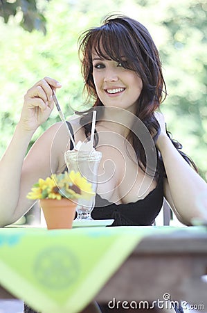 Young brunette woman with ice cream Stock Photo