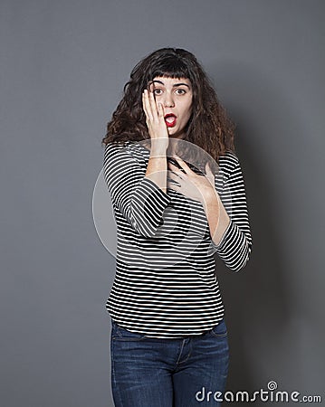 Young brunette woman looking disappointed Stock Photo