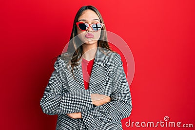 Young brunette woman wearing fashion and modern look depressed and worry for distress, crying angry and afraid Stock Photo