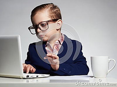 Young business boy. funny child in glasses. little boss in office Stock Photo