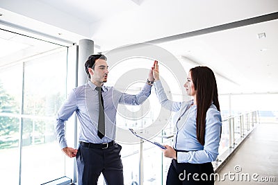 Young business colleagues celebrate success Stock Photo